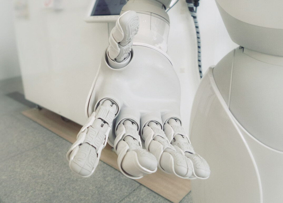 ai robot hand touching human