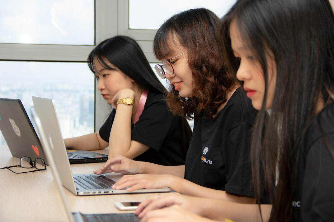 group of students coding together